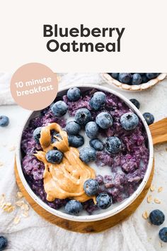 blueberry oatmeal in a bowl with peanut butter and blueberries on top