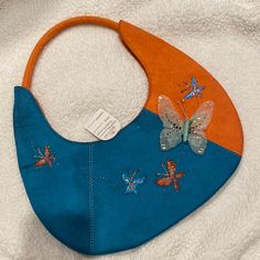 Orange And Teal Bag With Butterfly Details Blue Tote Hobo Bag For Spring, Blue Rectangular Hobo Bag For Spring, Blue Spring Hobo Shoulder Bag, Handmade Blue Shoulder Bag For Spring, Teal Bag, Butterfly Details, Vintage Bag, Vintage Bags, Blue Orange