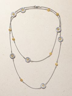 Buccellati's youthful 'Blossoms' collection marks the first ever silver line for the family-run house. Handcrafted from rhodium-plated sterling silver and gold vermeil, this necklace is adorned with daisy charms that are inlaid with tiny brown diamonds and intricately engraved using the brand's signature  rigato  technique to emulate petals. Style yours in a double layer or as a long, single drop. Exquisite Silver Necklace With Polished Finish, Elegant Hammered Silver Jewelry, Elegant Silver Hammered Jewelry, Luxury Hammered Round Necklace, Luxury Hammered Round Necklaces, Luxury Hammered White Gold Jewelry, Buccellati Jewelry, Brown Diamonds, Daisy Charm