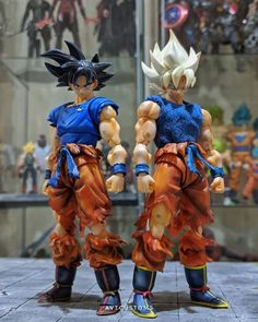 two action figures standing next to each other