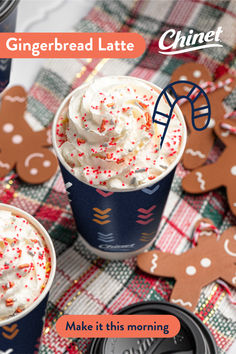 gingerbread latte with white frosting and sprinkles in cups on a plaid tablecloth