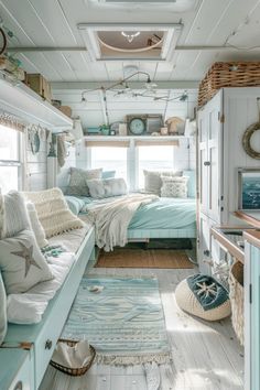 a bedroom with white walls and blue furniture in the room, along with other items on the floor