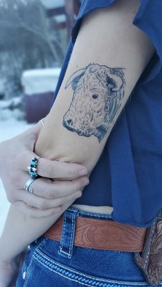 a person with a tattoo on their arm