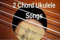 two chords with the words 2 chords ukulele songs in front of an acoustic guitar