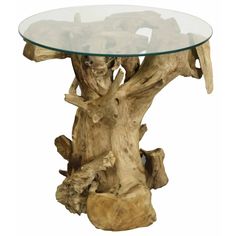 a glass top table with driftwood pieces on the base and bottom, in front of a white background