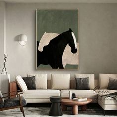 a living room filled with furniture and a painting hanging on the wall above it's head