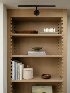 a book shelf with books and other items on it