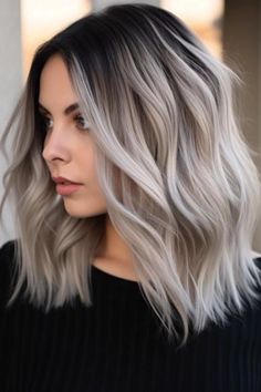 Go from coal black hair to icy blonde ombre for a dramatic statement. Thus, it makes a strong contrast for people who want to have a bold and edgy look. Click here to check out more best dark hair with blonde highlights ideas to try. Darker Platinum Blonde Hair, Dark Brown Hair With Ash Blonde Money Piece, Silver Grey Hair With Shadow Root, Silver White Hair With Dark Roots, Dramatic Blonde Hair Color Ideas, Grey Blonde Balayage Dark Roots, Icy Blonde And Black Hair, Black To Gray Balayage, Dark And Platinum Balayage