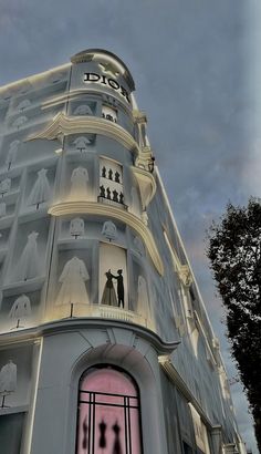 an artistic rendering of a building with people on it