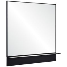 a large white mirror sitting on top of a black shelf