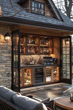 an outdoor bar is built into the side of a house