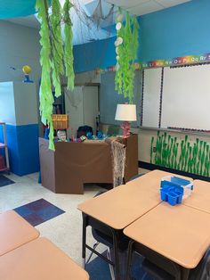 an empty classroom with desks and chairs