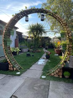 a circular mirror sitting in the middle of a yard