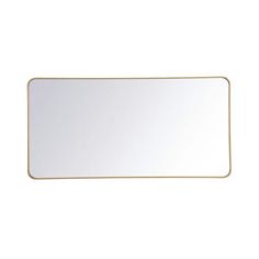 a white and gold rectangular mirror on a white wall