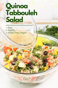 someone pouring dressing into a salad in a glass bowl with the title quinoa tabbouleh salad