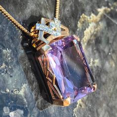 When ordering, please give us your phone number for safer Fedex shipping!Size: 16mm x 29mm Chain: 42cm Metal Type: 14 k Gold   Weight: 10.4 grams Stones: Amethyst, Diamonds Diamonds: 0.1 ct. Cut: Single cut Clarity: Si Color: J Condition: Excellent Stunning amethyst and diamond Art Deco Pendant. The amethyst has a charming, magical  purple color and the altogether 0.1 ct. diamonds with J color and Si clarity compliment it very well. The pendant weighs 10.4 grams and is 29 mm long and 16 mm wide. Luxury Purple Diamond-cut Jewelry, Luxury Rectangular Amethyst Jewelry, Luxury Purple Rectangular Jewelry, Gold Amethyst Jewelry With Diamond Cut, Purple Rectangular Jewelry For Formal Occasions, Formal Rectangular Purple Jewelry, Formal Purple Rectangular Jewelry, Formal Rose Gold Amethyst Necklace, Formal Engraved Purple Jewelry