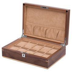 This lovely walnut watch box will keep all your timepieces organised. Made from quality medium-density fiberboard and finished tastefully with walnut veneer and detailing. Silver-toned metal fittings contrast gracefully with the wood. The velvet lined interior contains 10 individual compartments and a pocket on the inside of the lid, for additional storage. A metal lock and key are provided for added security and peace of mind. This box is guaranteed to look stunning in any setting and on any tabletop or shelf. A wonderful gift idea for an upcoming birthday or anniversary. Wood Box Design, Watch And Jewelry, Wooden Watch Box, Wooden Watch, Jewelry For Men, Square Rings, Walnut Veneer, Watch Box, Nixon