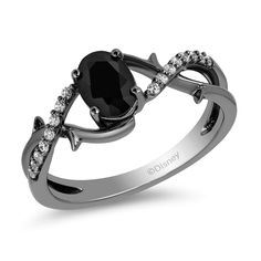 PRICES MAY VARY. Officially Licensed Disney Jewelry - Enchanted Disney Fine Jewelry Maleficent Ring in Black Rhodium Over Sterling Silver 1/10 Cttw Diamonds and 7X5MM Oval Onyx Dimension - L: 20.6 mm, W: 8.1 mm, H: 22.8 mm Inspiration – Wear Maleficent inspired jewelry to express your own power. Her horns ward off misfortune, her wings give your spirit the strength to rise above adversity, and her thorns protect you from harm. Black diamonds and onyx sparkle with her dark glamor. Worry Free Shop Maleficent Ring, Disney Rings, Enchanted Disney, Enchanted Disney Fine Jewelry, Disney Fine Jewelry, Jewelry Black, Disney Jewelry, Black Rhodium, Shop Engagement Rings