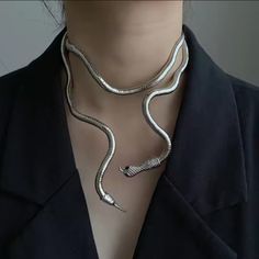 This Coiled Snake Necklace Embodies A Bold And Avant-Garde Design, Perfect For The Modern Fashionista Seeking An Edgy Yet Sophisticated Statement Piece. The Sleek, Metallic Finish Enhances Its Sculptural Form, Creating An Air Of Luxury And Confidence. Its Intricate Detailing, From The Textured Scales To The Elegantly Crafted Head And Tail, Exudes Both Artistry And Opulence. Whether Paired With A Minimalist Ensemble For A Chic, Contemporary Look Or Used To Elevate An Evening Outfit With Its Drama Egirl Jewelry, Anime Necklace, Punk Choker, Serpent Necklace, Snake Choker, Necklace Aesthetic, Womens Chokers, Aesthetic Jewelry, Snake Jewelry