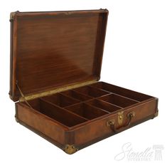 an old wooden box with many compartments on the inside and outside, open to show what's inside