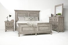 a bedroom scene with focus on the bed and dresser