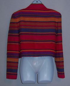 "Vintage Emanuel Ungaro hot pink, red, blue, and purple striped stripes Southwest serape style fringed wool jacket, blazer or coat. Excellent pre-owned condition. No holes, stains, rips, tears, etc. Women's size 12 or 46. Measurements: bust-46\", length-19\", waist-34\". Lined. Button front. 69% wool, 20% acrylic, 11% cotton. One button closure. Bright and fun!" Striped Long-sleeved Wool Blazer, Striped Wool Blazer With Long Sleeves, Fitted Striped Wool Outerwear, Fitted Multicolor Wool Outerwear, Fall Striped Wool Blazer, Striped Wool Blazer For Fall, Striped Long Sleeve Winter Blazer, Striped Long Sleeve Blazer For Fall, Striped Long Sleeve Blazer For Winter