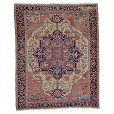 an antique rug with various colors and designs