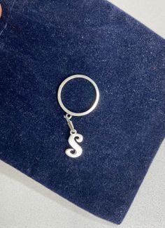 James Avery dangle ring. Size 6-6.5. Has letter A charm in script font; the A is the small size charm at 3/8". It is attached with a wire and crimp rather than a ring.  The ring is very solid with logo clearly visible.  James Avery lists ring alone at $38 and the Charm at $48. James Avery Charms, 1980s Bands, James Avery, Script Lettering, Band Rings, Jewelry Gifts, Jewelry Rings, Band, Sterling Silver