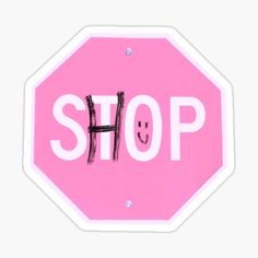 a pink stop sign with a smiley face drawn on it