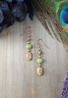 Embrace your boho spirit with our Copper & Unakite Earrings. Earthy olive & peach hues mingle in perfect harmony, creating a mesmerizing dangle that whispers stories of forests & sunsets. A treasure for bohemian souls, these earrings add an ethereal touch to any outfit. Let nature inspire your style. You will love wearing these unique earrings with any outfit whether casual or dressy. All of my jewelry creations come in a beautiful satin drawstring bag perfect for gift giving. E101 Bohemian Green Copper Jewelry, Green Teardrop Bohemian Jewelry, Bohemian Green Teardrop Jewelry, Bohemian Green Earrings With Natural Stones, Green Bohemian Drop Earrings, Bohemian Green Dangle Earrings, Bohemian Green Drop Earrings, Bohemian Green Summer Jewelry, Green Bohemian Beaded Drop Earrings