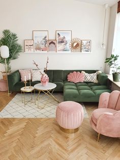 a living room filled with lots of furniture and pink velvet couches on top of hard wood flooring