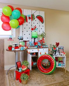 a room filled with lots of decorations and balloons