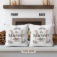 two personalized pillows sitting on top of a fireplace