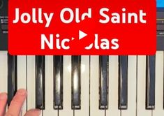 someone is playing the piano with an old saint sign above it that says, jolly old saint nic - also