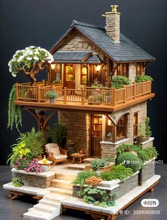 a doll house with lots of plants and flowers on the front porch, stairs to the second floor