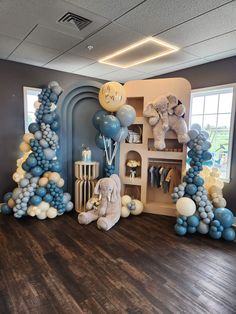 an elephant themed room with balloons and decorations