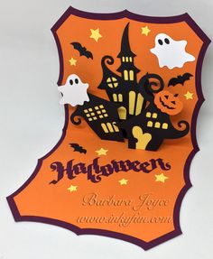 an orange and black halloween card with pumpkins, ghost's and castle on it