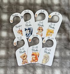 the baby's bibs are numbered with their names and pictures on them, as well as numbers