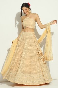 Peach attached cancan lehenga with swarovski, chikankari embroidery in floral pattern. Paired with halter neck embroidered padded blouse and cutwork border embroidered dupatta. - Aza Fashions Sleeveless Lehenga With Chikankari Embroidery For Festive Occasions, Sleeveless Lehenga With Chikankari Embroidery For Diwali, Diwali Lehenga With Chikankari Embroidery, Festive Sleeveless Lehenga With Chikankari Embroidery, Cancan Lehenga, Chikankari Embroidery, Floral Lehenga, Padded Blouse, Embroidered Dupatta