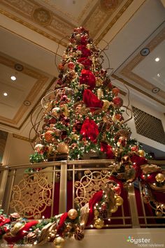 a decorated christmas tree with red and gold ornaments