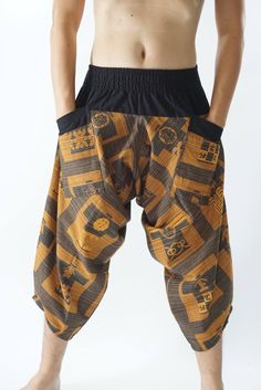 "Male Model Tall 5'9\" Waist 34\" Samurai Pants - elastic waistband and cuffs - Fits all! Unisex pants These beautiful casual pants is unique & comfortable to wear Handmade with a very lovely pattern, it is easy to wear and great for many occasions. One size fits most. These pants are great for many different activities like traveling, dancing, going to festivals, rock climbing, yoga, meditation, massage, working out, martial arts, Taichi MATERIAL: 100% Cotton APPROX MEASUREMENT: Waist: 24\" Brown Casual Pants For Festivals, Casual Brown Pants For Festival, Brown Festival Bottoms With Elastic Waistband, Brown Bottoms With Elastic Waistband For Festival, Baggy Brown Harem Pants With Elastic Waistband, Traditional Brown Bottoms For Festival, Casual Baggy Harem Pants For Festivals, Brown Baggy Bottoms For Festival, Harem Pants With Pockets For Festivals