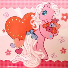 a pink pony holding a teddy bear on top of a checkered tablecloth background