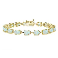 PRICES MAY VARY. FEATURE - This classis tennis bracelet displays 7x5mm oval synthetic white opal gemstones. This gemstone bracelet in fine jewelry is a great addition to your opal jewelry and gemstone jewelry collection; it will enhance your daytime and evening attire. It can be purchased as tennis bracelets for women and tennis bracelets for teen girls. CRAFTED - The bracelet is crafted of fine yellow gold flashed sterling silver and is nickel & tarnish free. The bracelet measures 7.25 inches a Silver Bracelets For Women, Bow Bracelet, Bracelet Display, Classic Bracelets, Opal Color, Opal Bracelet, October Birthstone, Bracelet For Women, October Birth Stone