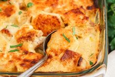 a casserole dish with chicken and cheese in it, ready to be eaten