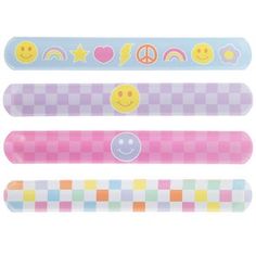 four different colored pencils with smiley faces and hearts on the top one has a peace sign