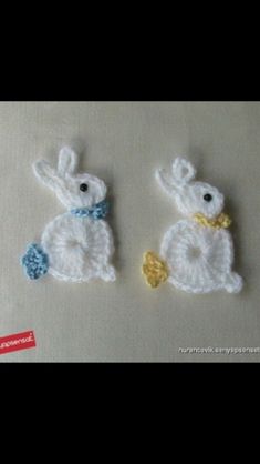 two crocheted rabbits sitting next to each other