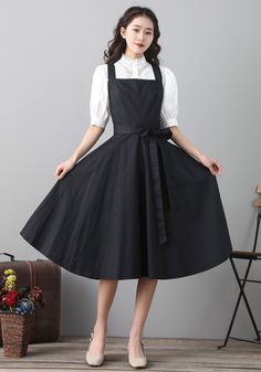 "Details: * 50% cotton, 50% fiber * Has no pockets * Back zipper closure * Black pinafore dress * Perfect Spring summer * Dry clean * The model is 168cm (5′6″) tall with a 80cm (31.5\") bust, 66cm (26\") waist. She is wearing a XS in black. * Choose CUSTOM Order if you Need a better fit Can't find your size in our size Chart Change the Style Chang the Length Your Height is not Between 5'1\" - 5\"9\" SIZING AND FIT, Garment size as follow XS Waist 26\" Length 43\" S Waist 28\" Length 43\" M Waist Suspender Dress For Women, Black Apron Dress, Pinafore Dress Black, Black Pinafore Dress Outfit, Corporate Witch, Rare Dresses, Womens Pinafore Dress, Pinafore Dress Outfit, Pinafore Outfit