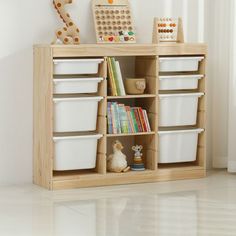 a wooden shelf with bins and toys on it