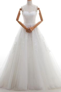 a white wedding dress on a mannequin