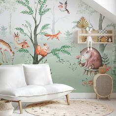 a living room with a white couch and wallpaper that has animals painted on it